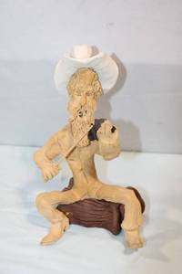 lot 143 image: Handcrafted Clay Sculpture of a Cowboy Playing Violin
