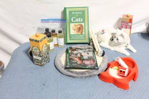 lot 288 image: Collection of Cat-Themed Items including Book, Figurine, and Toys