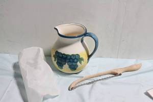 lot 307 image: Fruit Pattern Ceramic Pitcher and Wooden Grapevine Cutter