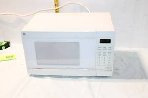 lot 399 image: GE 0.7 Cu.Ft. Countertop Microwave