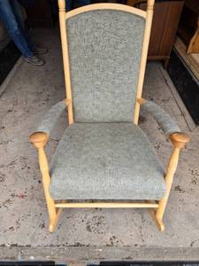 lot 7 image: Upholstered Wooden Rocking Chair with Cushioned Back and Armrests