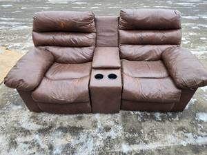 lot 19 image: Brown Dual Recliner Loveseat with Cup Holders and Storage Compartment