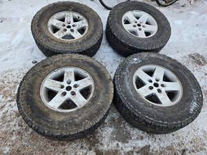 lot 38 image: Set of 4 Used LT28575R17 Tires with Alloy Rims