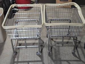 lot 56 image: Lot of 2 Rolling Laundry Baskets - One has bad wheel - See Pics for Conditions
