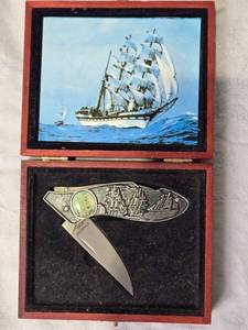 lot 85 image: Collectors Edition Stainless Steel Folding Knife with Ship Design