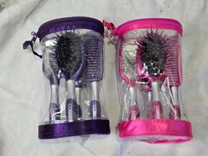 lot 145 image: Conair Hairbrush and Comb Sets in Pink and Purple Cases