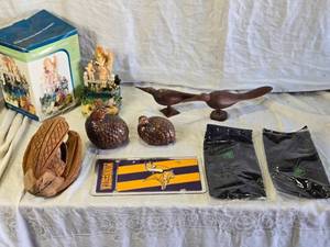 lot 220 image: Collection of Assorted Decorative Items, Carved Coconut, Minnesota Vikings License Plate, Pioneer Wallets, Ceramic Birds and More