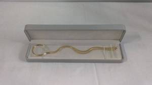 lot 49 image: Gold-Toned Serpentine Design Tie Bar in a Gray Box 3mm 18 Inch
