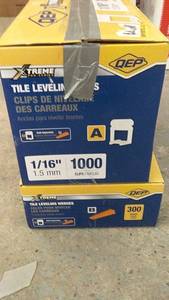 lot 243 image: QEP Tile Leveling Clips and Wedges, Part A 1000 Clips  Part B 300 Wedges