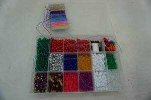 lot 109 image: Pony beads & elastic string in organizer