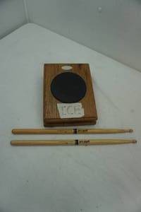 lot 245 image: drum practice set with drumsticks