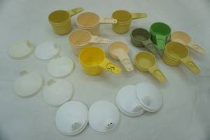 lot 361 image: Tupperware measuring cups and sippy cup lids
