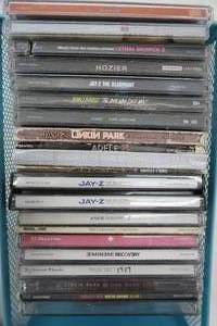 lot 399 image: Metal CD holder and contents Taylor Swift, Jay-Z, Highly Suspect, Eminem