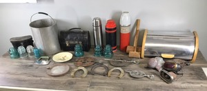 lot 45 image: Lot of Vintage Items - Metal Plate  - Insulators - Horseshoes - Car Parts - Thermos and More