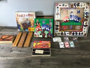 lot 49 image: Lot of Games - Cribbage Boards - Dragon Dominoes - NFL-Opoly - Ticket to Ride (Never been opened), PIT, Rook, Authors, Poker 