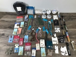 lot 54 image: Lot of Jewelry Making Material and More - Plastic-Metal-Ceramic & Glass Beads - Clasps - Spring Rings - Pendants - Charms - Beading Wire - Earring Hooks & Backs - Head Pins - 6 Piece Easel Back Jewelry Display