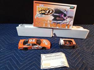 lot 158 image: 2000 Nascar Rookie of the Year Tony Stewart #20 die cast car bank set with certificate of authenticity