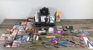 lot 100 image: Lot of Misc. - Tools - Batteries - Phone Chargers - Lighters and More