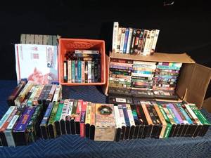 lot 239 image: 2 boxes and a crate of VHSs