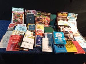 lot 236 image: Tote of cookbooks from 1950 & up including 1 from Wrought Iron Range Co. (no date) and 1 The Ball canning blue book edition G