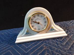 lot 233 image: Laura Ashley Parfums porcelain mantle clock floral with gold edging