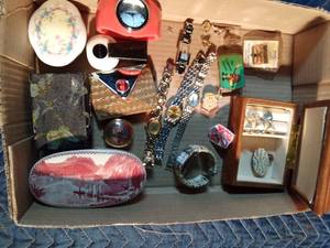 lot 229 image: Flat of watches, rings, tie tacks, pins, California Raisin belt buckle, trinket boxes, and more