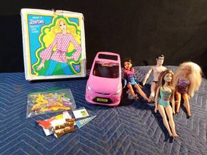 lot 193 image: 1974 Barbie fashion doll case, Vintage Barbie book and accessories & hangers, 3 fashion dolls and 1 beauty and the beast doll and Barbie car
