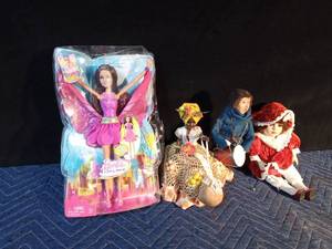 lot 246 image: Barbie Fairy Secret doll, Doll of the Arc, ryer Caroler and a porcelain doll