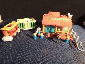 lot 278 image: 1982 fisher Price Western town with accessories and 2 circus train cars