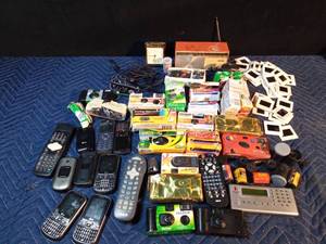 lot 293 image: Vintage cameras, cell phones, alarm clock, film, slides, interwriter and more