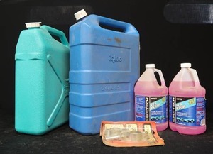 lot 52 image: 2 SIX GALLON JUGS, 2 BOTTLES OF ANTIFREEZE, AND OARLOCKS