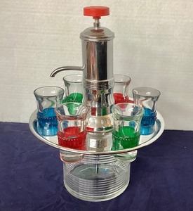 lot 14 image: Mid Century Modern Chrome Carousel Liquor Dispenser & Shot Glasses
