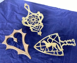 lot 77 image: Trio of Antique Footed Brass Trivets