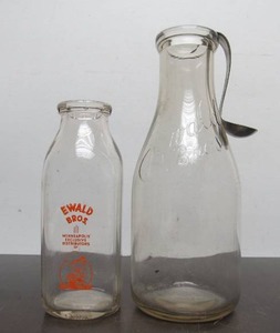 lot 62 image: 2 Old Vintage EWALD BROS DairyMilk Bottles
