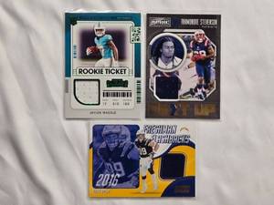lot 48 image: Lot of 3 NFL Relic Cards - Jaylen Waddle Rookie Ticket, Joey Bosa, Rhamondre Stevenson