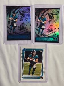 lot 68 image: Lot of 3 Trevor Lawrence Rookie Football Cards - 2021 Panini Illusions No. 59 & Rated Rookie No. 251