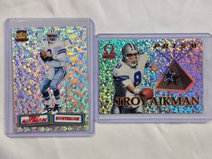 lot 159 image: Lot of 2 Troy Aikman Premium Inserts - 1994 Pacific No. 1, 1998 Pacific Omega Prism No. 3