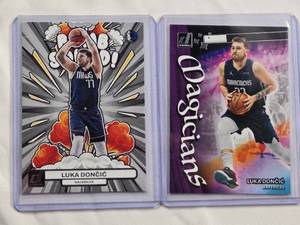 lot 261 image: Lot of 2 Luka Doncic Inserts - 2022-23 Panini Donruss Magicians No. 2 & 2023-24 Panini Donruss Bomb Squad No. 3