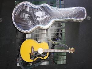 lot 250 image: Elvis Presley Mini Guitar & Case