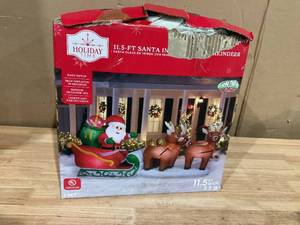 lot 406 image: Holiday Time Christmas Airblown Yard Decoration Santa in Sleigh with Reindeer