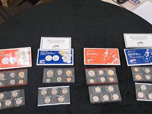 lot 212 image: U.S. Mint Uncirculated Coin Sets -  2004 Philadelphia Mint 11-pc, 2004 Denver Mint 11-pc, 2005 Philadelphia Mint 11-pc, 2005 Denver Mint 11-pc