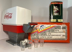 lot 4 image: Vintage Coca-Cola Kids Soda Fountain Dispenser, Coca-Cola Bear Ornament and Super Joe Adventure Team Case