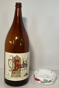 lot 15 image: Bubs Beer Label Half Gallon Picnic Bottle and Peter Stuyvesant Vintage Milkglass Ashtray