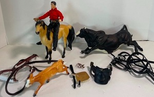 lot 27 image: Breyer Cowboy, Horse, Bucking Bull and Carol Herden Calf