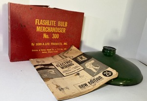 lot 77 image: Vintage Flashlite Bulb Merchandiser No. 300 Box with Some Bulbs and Enamel Light