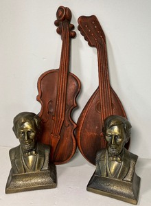 lot 192 image: MCM Cast Metal Instrument Wall Hangings, Abraham Lincoln Bookends