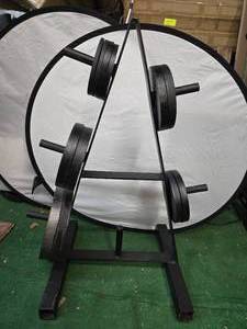 lot 10 image: Lot of a Pair of 25LB, Pair of 10LB, Four 5LB and Four 2.5LB Two-Inch Metal Plates with a storage rack (Used, Like New)