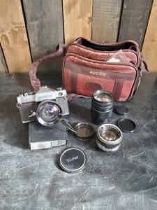 lot 39 image: Vintage Yashica Camera with Case and Vivitar Telephoto Lense and More Quality