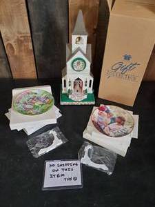 lot 49 image: Never used Avon Gift Collection Church Clock and Plates