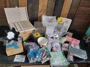 lot 26 image: Lot of New still in Packages Avon Items Jewelry Case, Satchels, Baking Tins, and More